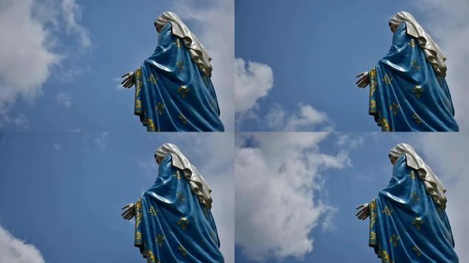 圣母玛利亚雕像在天空上移动