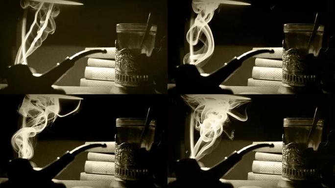 旧电影风格的桌子在书房里的镜头: 吸烟烟斗，书籍和茶在玻璃温室中