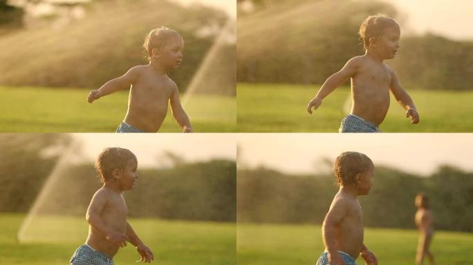 婴儿奔跑在超级慢动作120帧/秒，背景是洒水在日落黄金时间。mov