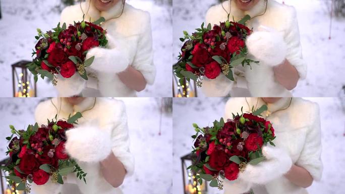 新娘穿着冬衣，手捧一束红玫瑰