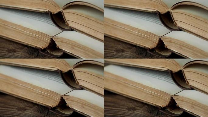 木制桌子上的旧打开书