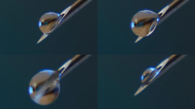 水滴在倾斜的针头上膨胀，然后在实验室中掉落