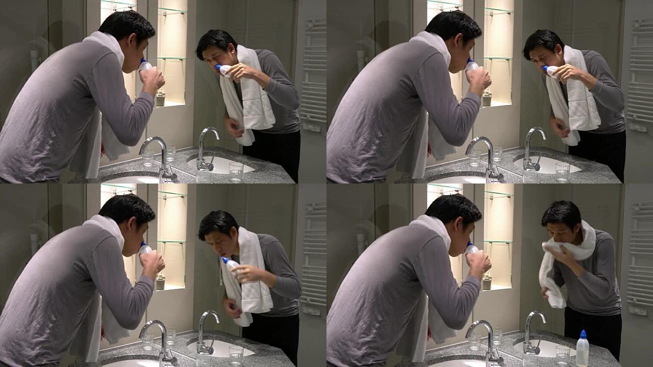 男子在家中使用鼻腔冲洗以预防慢性病