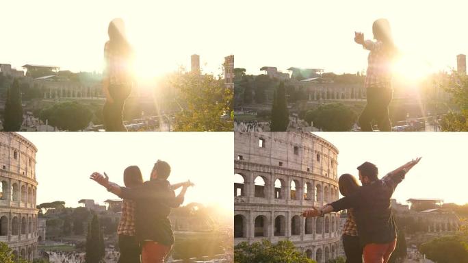 浪漫的年轻夫妇游客日落时在罗马斗兽场前做标志性的泰坦尼克号场景男朋友抱着女朋友张开双臂快乐美丽的女人