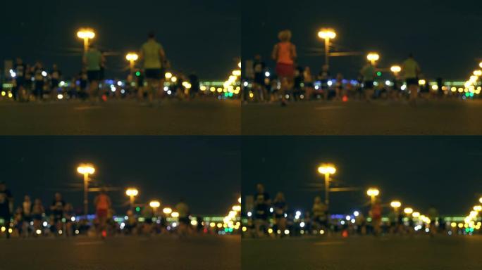 夜间城市跑步，带led灯的人群跑步，午夜跑步，每年夏季举行的短途马拉松比赛，模糊中的无法识别的人，l