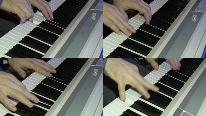 音乐家用数字钢琴演奏。钢琴家的手。合成器或电子钢琴