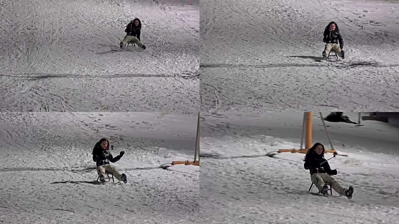 孩子在冬天晚上拉雪橇，女孩在雪地上奔跑和摔倒。UHD股票视频