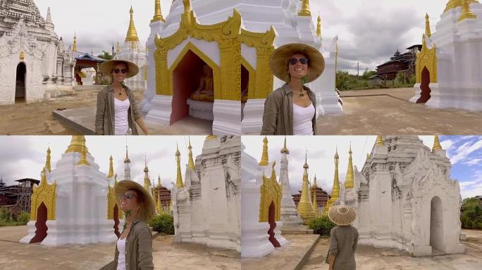 缅甸茵莱湖，一个年轻女子在佛教寺庙里游荡