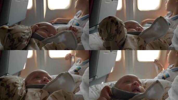 婴儿与家人乘飞机飞行，并在做好梦后醒来