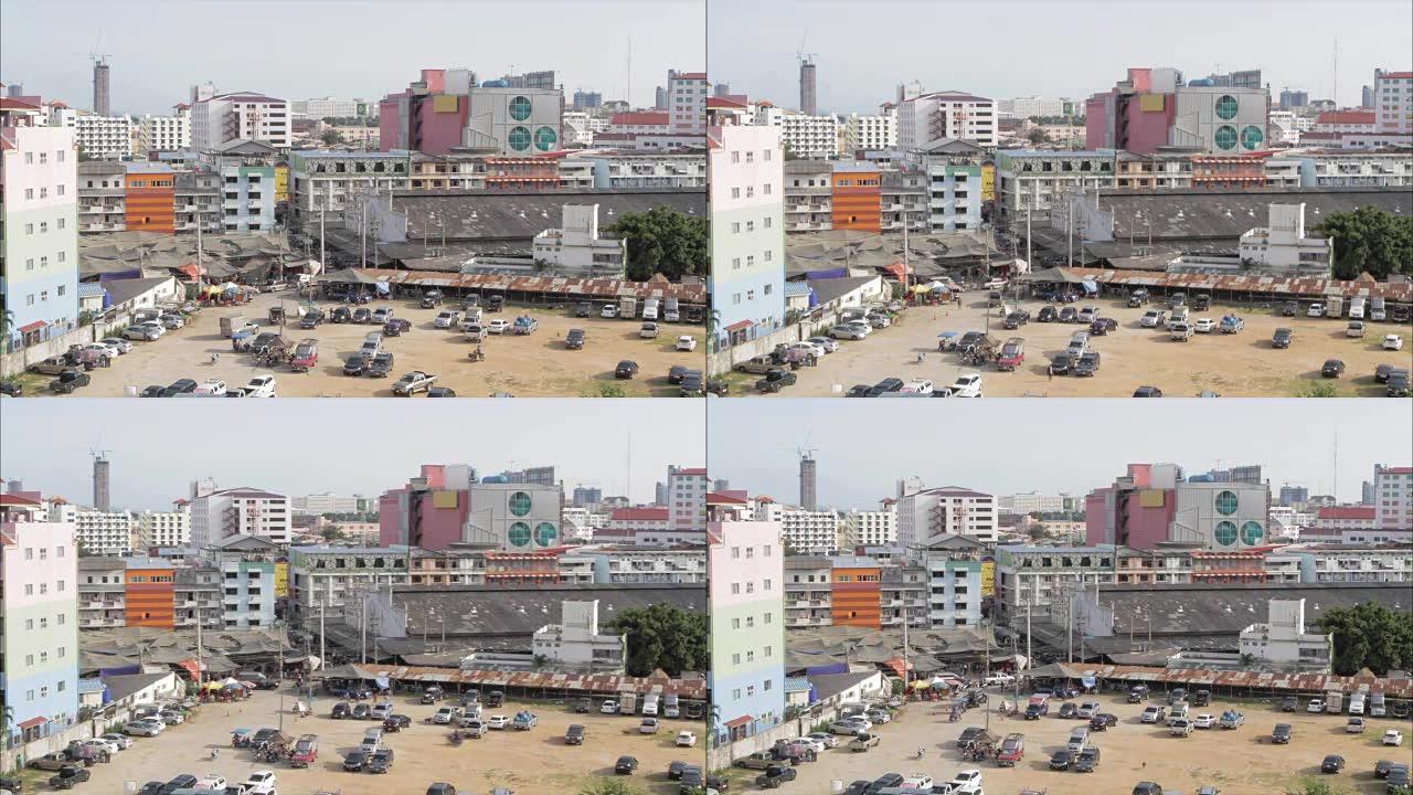 在泰国的贫民窟停车。视频。城市南部贫民窟的建筑。很多汽车、广告牌和房子