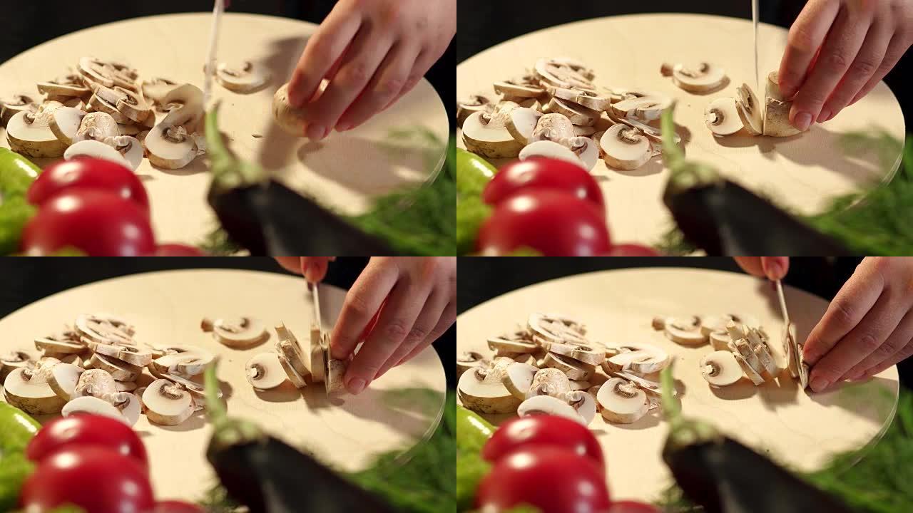 切菜板上切蘑菇的女孩特写