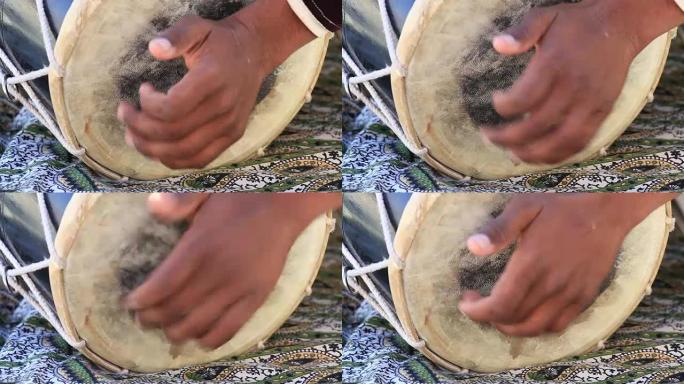 男子在印度拉贾斯坦邦斋沙默尔堡的邦戈鼓上演奏