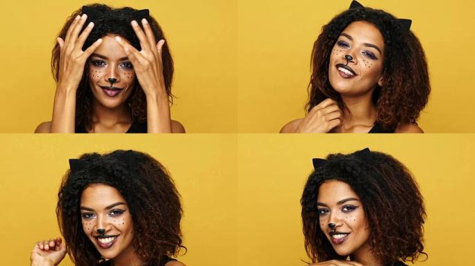 漂亮的非洲女士，猫化妆，耳朵玩弄卷发，在黄色上调情