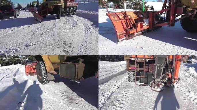 冬季除雪机正在道路上撒盐，沙子。UHD 4k steadycam库存镜头