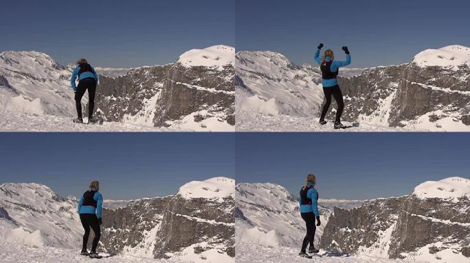 一个女人跑到山顶庆祝。