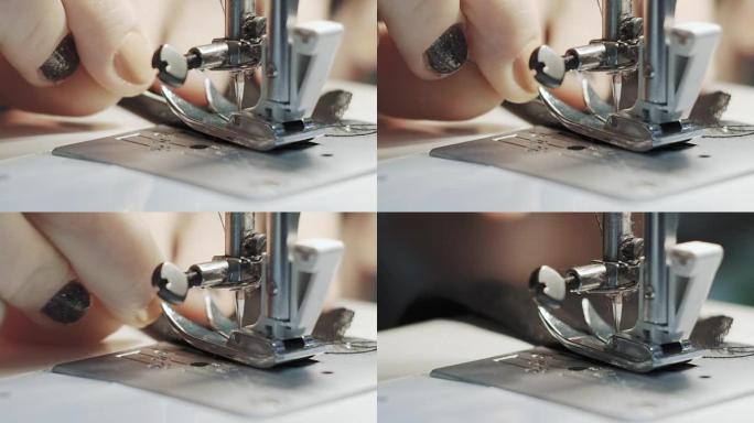 在缝纫机上工作的女性手的特写镜头。年轻女性概念设计师在家里做缝纫机。时尚和剪裁。慢动作