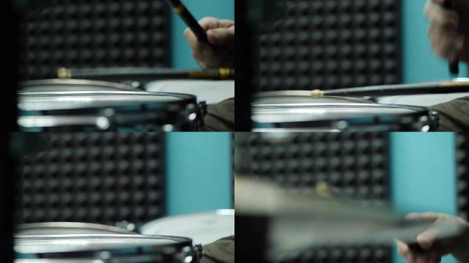 鼓手手中的鼓槌在架子鼓上的特写镜头