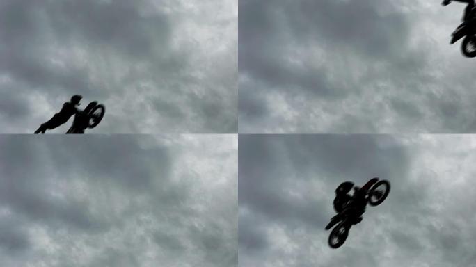 自由式摩托车越野赛FMX骑手慢动作跳跃剪影。七名勇敢的摩托车手一个接一个地在接近跳板后空翻的危险中跳