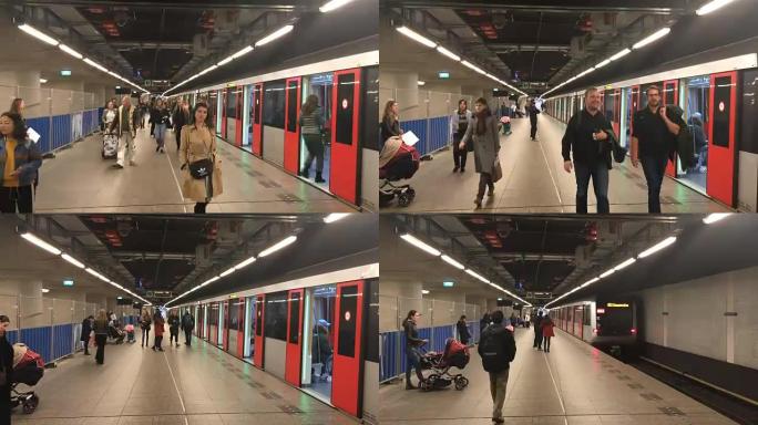 在荷兰阿姆斯特丹的阿姆斯特丹地铁中央车站，人们从地铁列车上下来的时间流逝