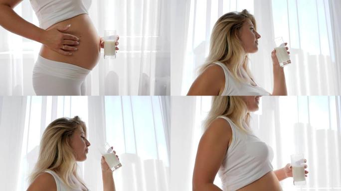 美丽的孕妇擦肚子喝奶制品