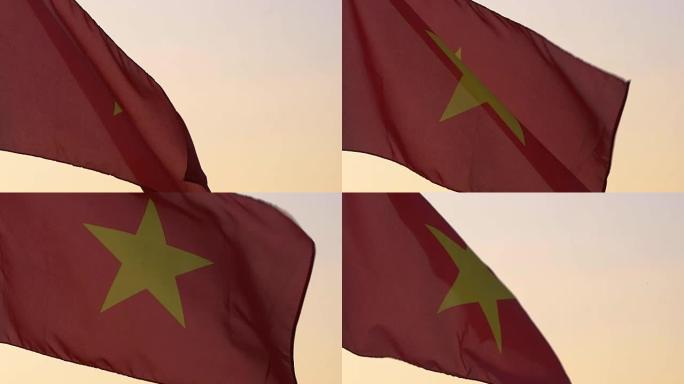 越南国旗在日落的天空上挥舞。