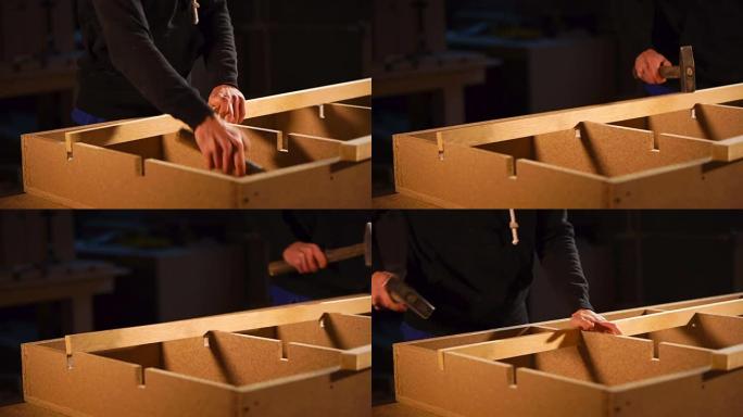 close up shot of a man's hands who inserts a board