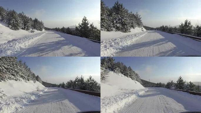 快速跑车在冬季雪道上行驶，上山