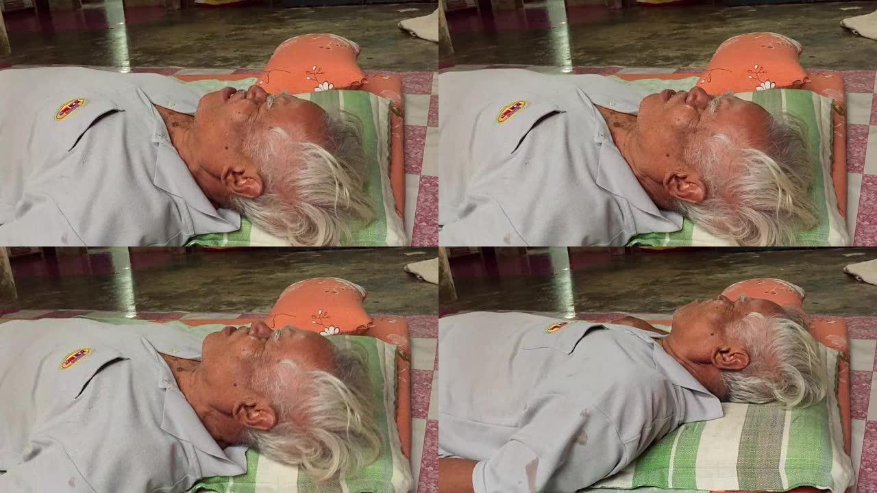 亚洲泰国老人在泰国按摩时受伤