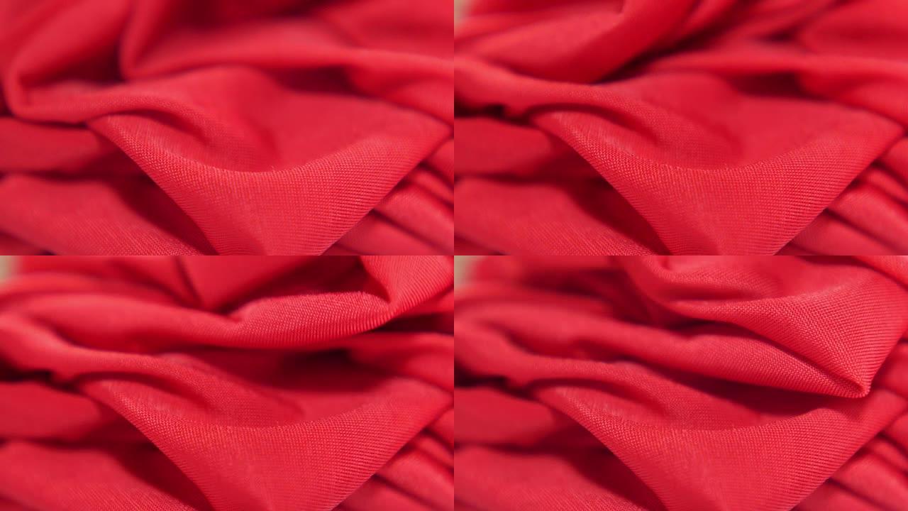 红色缎面织物背景，慢动作