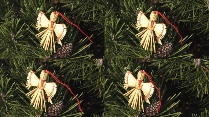 圣诞树上的稻草天使/圣诞天使，圣诞节时间。装饰圣诞树的天使的形象。
