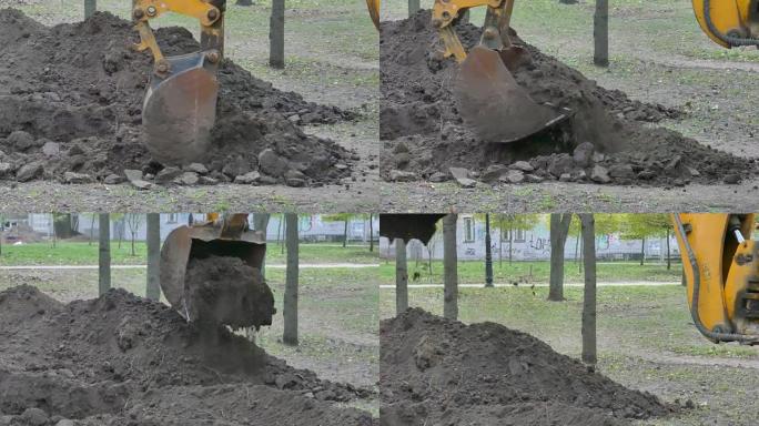 挖掘机的铲斗挖地