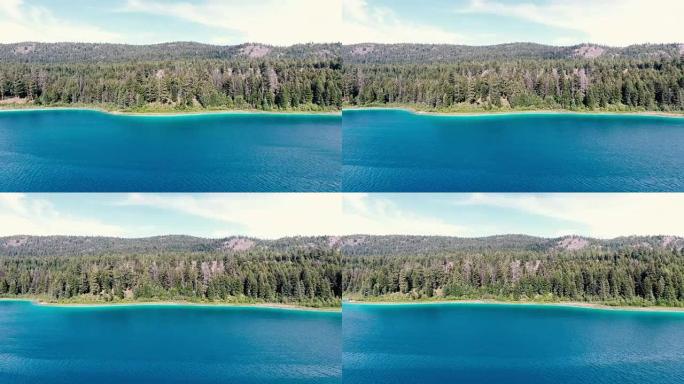 沿着清脆的蓝湖进行空中拍摄跟踪