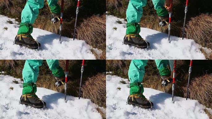 爬冰者加冰爪，换登山鞋。冬季雪主题，细节拍摄