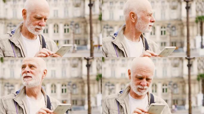 老人站在户外用手机。研究城市地图。迷失了寻找正确的方向