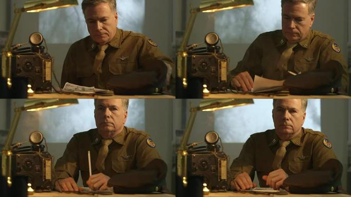 第二次世界大战的陆军航空兵上尉坐在办公桌前思考