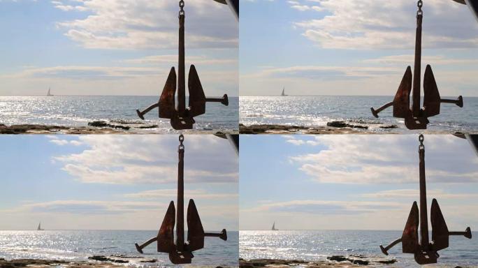 帆船在一个大锚的背景下航行