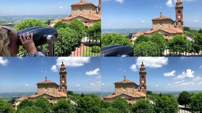 女人在皮埃蒙特地区美丽的Diano d'Alba教堂及其周围的全景中凝视着双目取景器