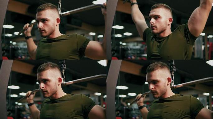 集中英俊的男人在健身房锻炼胸部肌肉和训练肩膀。4k拍摄