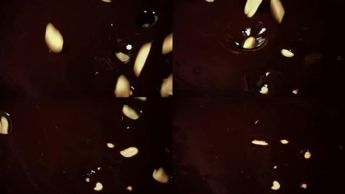 花生在真实慢动作中掉入巧克力的视频