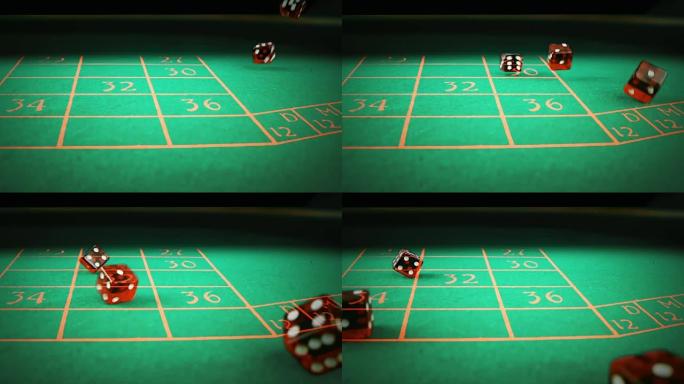 三个红色的骰子在绿色的赌桌上滚动，黑色的背景，射击用慢动作，运动休闲的概念游戏