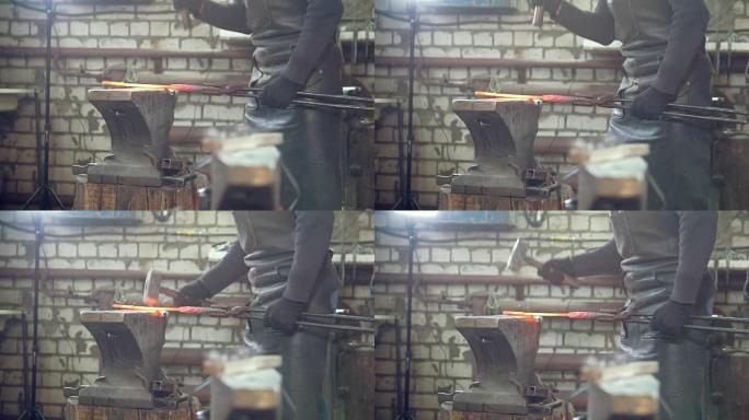 肌肉发达的铁匠用铁锤锻造钢刀