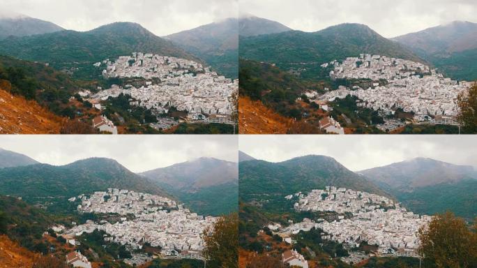 许多白色的房子高高在山上，全景，美丽的白色村庄的安达卢西亚在西班牙。