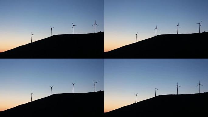 日落时风车在运动。凯法利尼亚。爱奥尼亚群岛。希腊。欧洲
