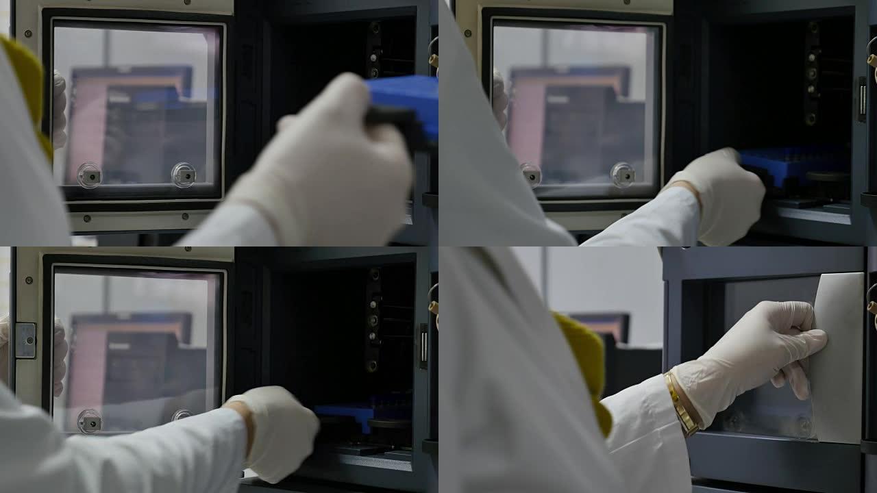一位科学家采集样本并将它们放入一个设备中进行进一步检查