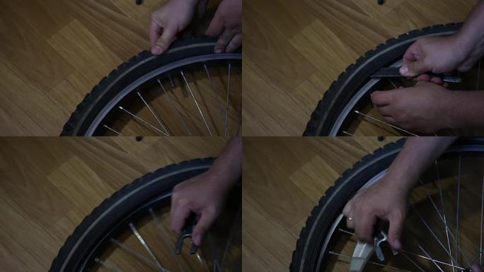 这个人把轮胎从自行车车轮上拿下来。