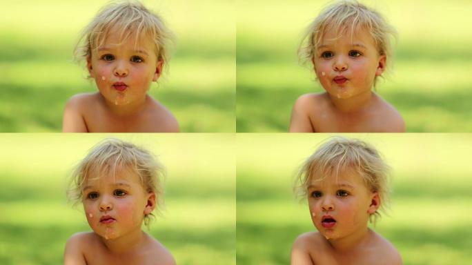 婴儿蹒跚学步的随意坦率的肖像从相机上注视着并活在当下。小男孩思维的4k剪辑分辨率