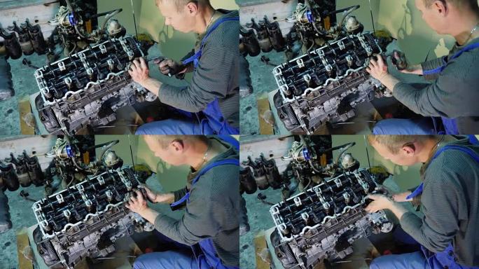 在修理厂修理旧汽车发动机