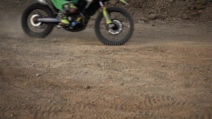 Motocross enduro rider in action accelerating the 
