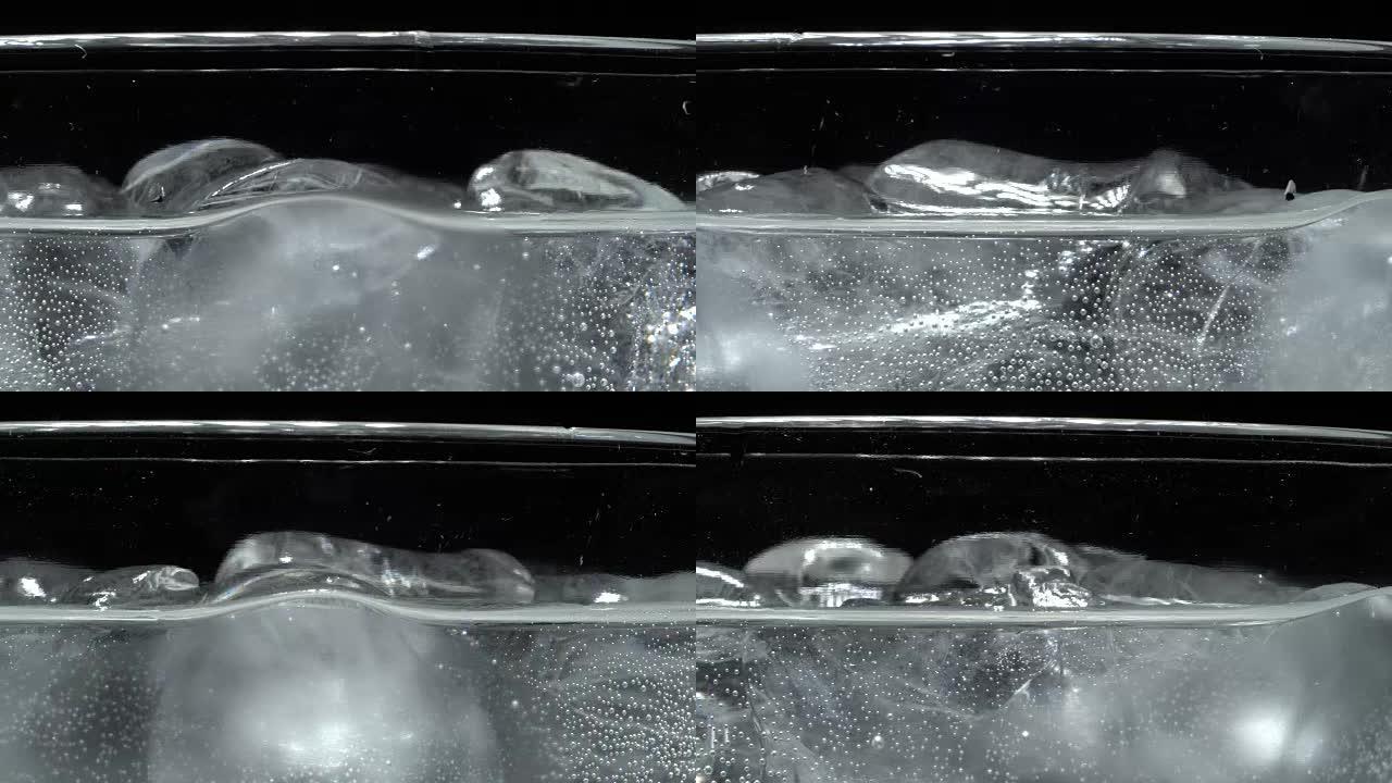 Bubbles on glass with sparkling water in rotation
