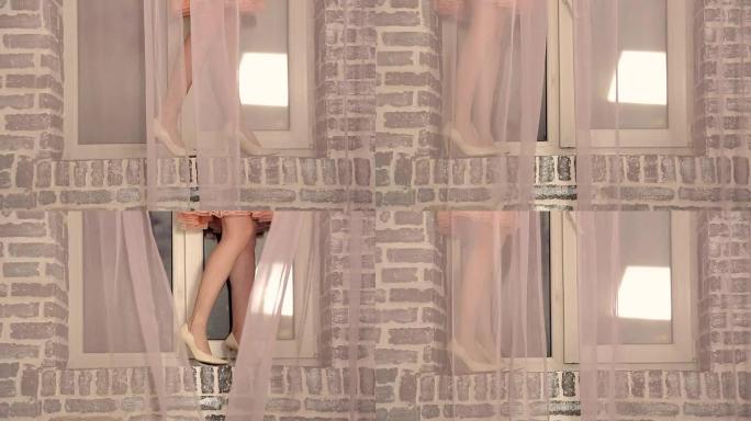 女孩穿着oragami裙子站在窗台上。女孩沉迷于裙子